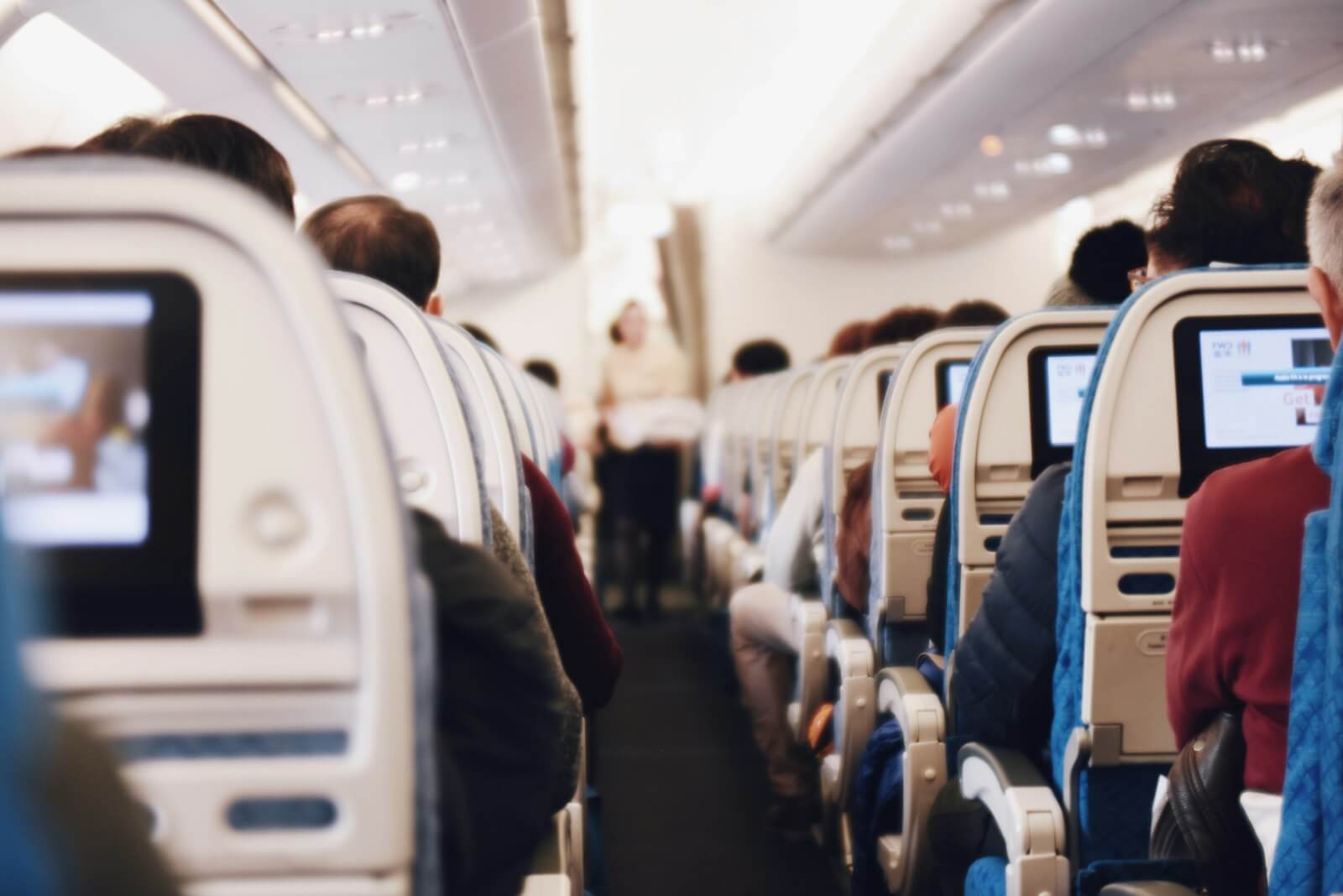 Delta Premium Select Basic: What You Lose Compared With Classic 35 Airplane cabin aisle, the kind of seat Premium Select Basic and Classic both fly in