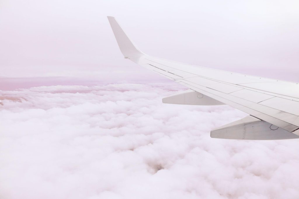 Earn Double Etihad Guest Miles on JetBlue Flights (Through November 30, 2026) 4 Airplane wing above clouds at altitude