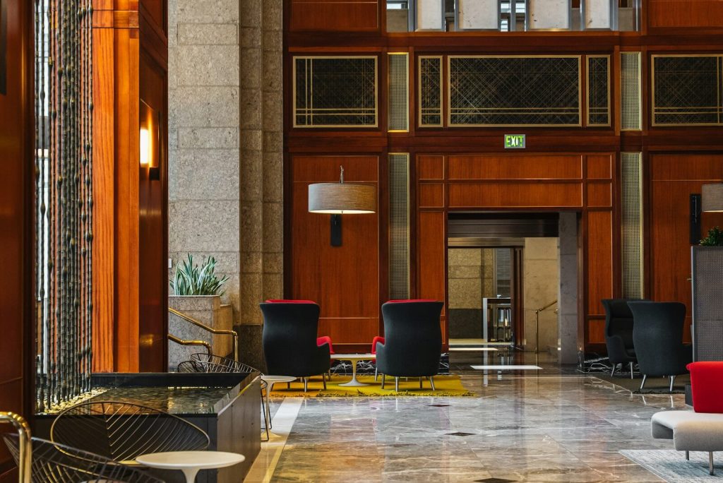How Marriott Elite Night Credits Work With Back-to-Back Stays 5 Elegant hotel lobby lounge with wood paneling and seating