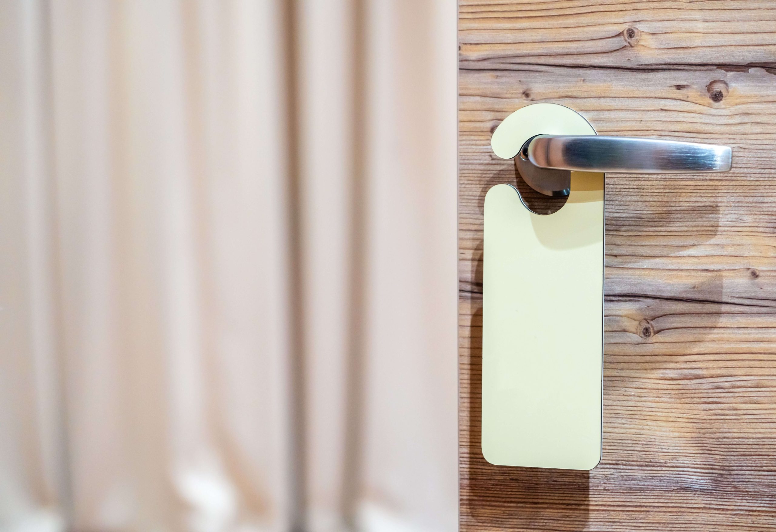 Hotel room door with key tag