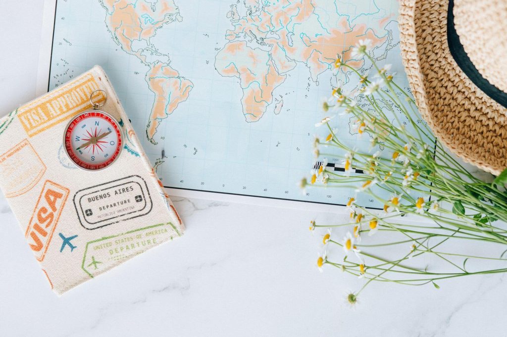 British Airways Lifetime Gold Status: How Lifetime Tier Points Work 8 World map with compass and passport, symbolizing a lifetime of travel