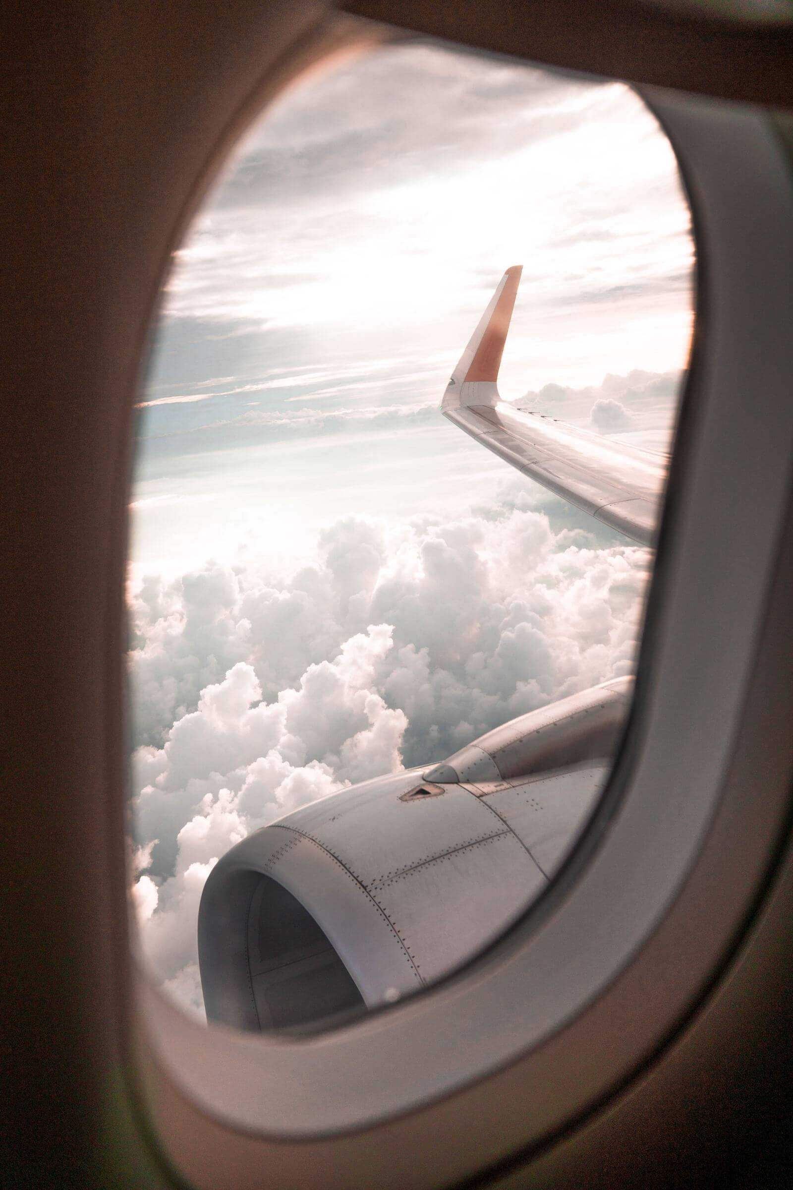 Delta SkyMiles Platinum Business Card Review: Is the $350 Fee Worth It? 4 Airplane wing and engine above clouds