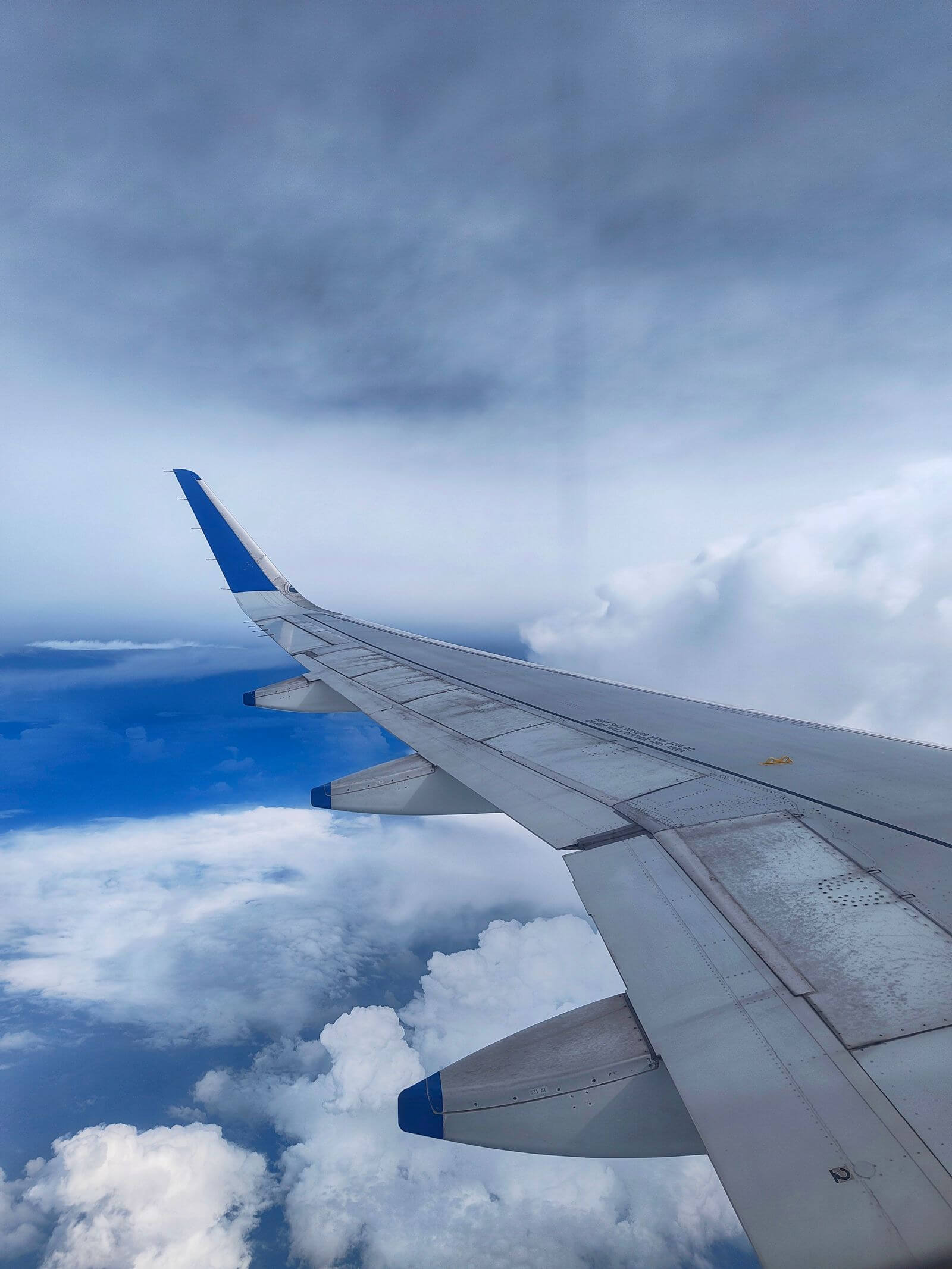 United Explorer Card Review: Is the $150 Fee Worth It? 5 Airplane wing above clouds during flight